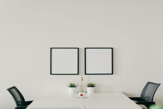 A blank wall and desk