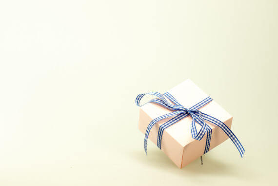 A gift with a blue and white ribbon
