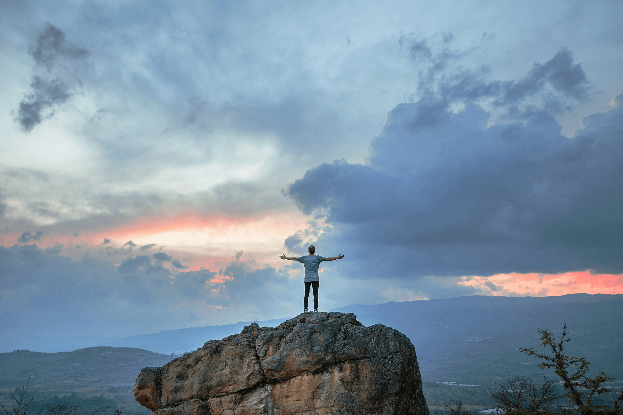 A man standing on top of a mountain